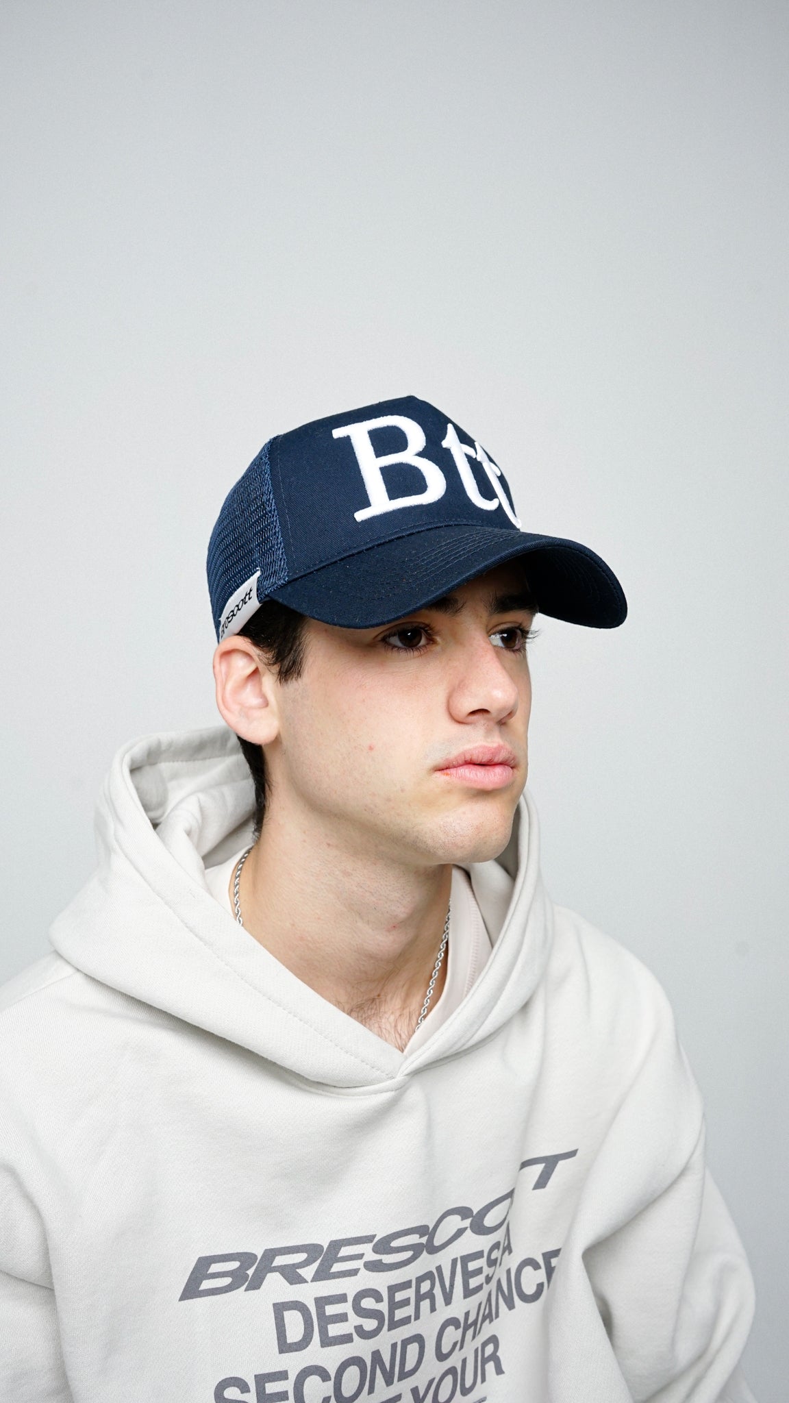 BACK IN" NAVY TRUCKER CAP